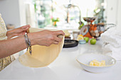 Woman rolling pie crust dough