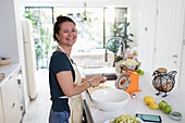 Portrait woman slicing apples for baking