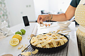 Woman baking fresh homemade lattice apple pie