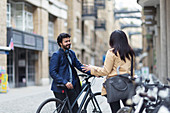 Business people with bicycles talking