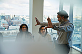 Businessman leading conference room meeting