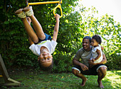 Happy family playing in summer backyard