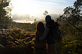 Couple hiking and enjoying tranquil nature view