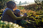 Happy hiking couple using camera