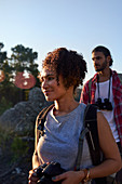 Young couple hiking with camera