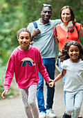 Happy family walking on path