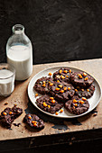 Dark chocolate and salted fudge cookies with milk