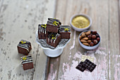 Vegan chai, chocolate and millet bites decorated with chocolate and pistachio nuts
