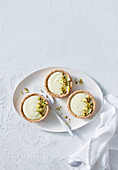 Vegan lemon tarts with pistachios