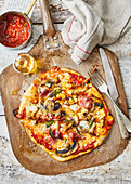 Mushroom and prosciutto pizza with truffle oil
