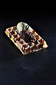 A waffle with dark and white chocolate mousse
