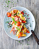 Omelette with ham and tomatoes