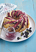 Lemon cream puff with blueberries and blueberry sauce