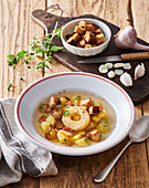 Garlic soup with cheese croutons and bacon