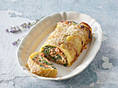 Potato roll with minced meat, spinach and ricotta