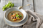 Potato soup with carrots and mushrooms