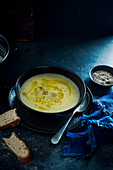 Winter jerusalem artichoke soup wit black pepper and olive oil