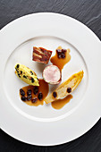 Pheasant breast wrapped in ham with raisins, chicory and polenta