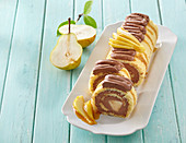 Roulade with chocolate cream and pears in caramel