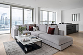 Modern open living space in a high-rise building with a panoramic view of the city