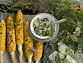 Herb quark and herb butter with grilled corn cobs