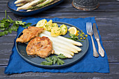 Breaded pork escalope with asparagus and parsley potatoes