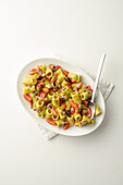 'Mezze maniche alla crudaiola' – pasta with capers, anchovies and olives