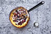 Dutch Baby (Puff Pancake) with Roasted Cherries and Panettone Croutons