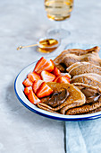 Cinnamon crepes with nutella and fresh strawberries