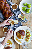 Braided bread served with fresh figs and sweet fruit jam