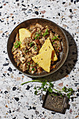 Creamy green lentils and mushrooms with polenta slices