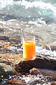 Healthy drink made from fruit, carrots and oat flakes in a stream
