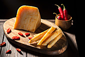 Hard cheese with chilli, in one piece and in sticks
