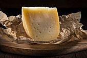 A wedge of hard cheese (quarter fat)
