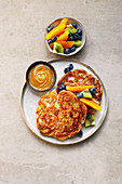 Vegan apple pancake with maple butter and fruit