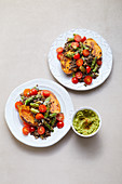Baked sweet potato with green asparagus and guacamole