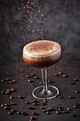 Glass of foamy coffee liquor decorated with chocolate