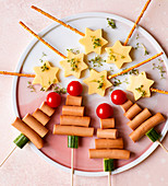 Christmas snacks on stick with cheese and sausages