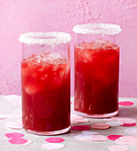 A pink lady mocktail made with rhubarb juice and raspberry juice