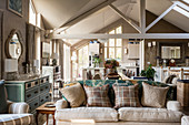 Classic, beige living room with exposed roof structure