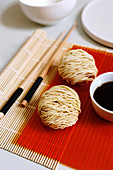 Balls of dried noodles with soy sauce