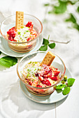 Quick tiramisu with strawberries and shortbread in glassbowl