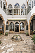 Oriental palace with arcades and fountain in courtyard