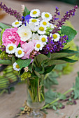 Posy of roses, feverfew and salvia