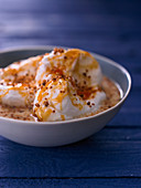 Ile Flottante with syrup and nut brittle