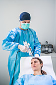 Doctor performing skin rejuvenation using Mesolift