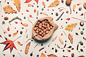 Hazelnuts in burlap sack with autumn decoration