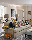 Beige sofa in classic living room with stucco elements