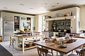 Large kitchen-dining room in English country-house style decorated in cream