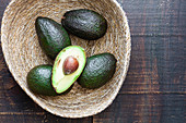 Bowl with fresh avocados